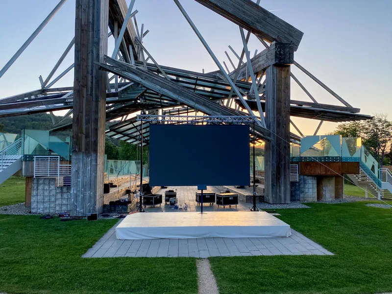 Outdoor LED wall beneath an architectural structure